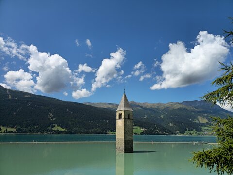 Wide Alpine View of Curon Bell Tower in Lake Resia