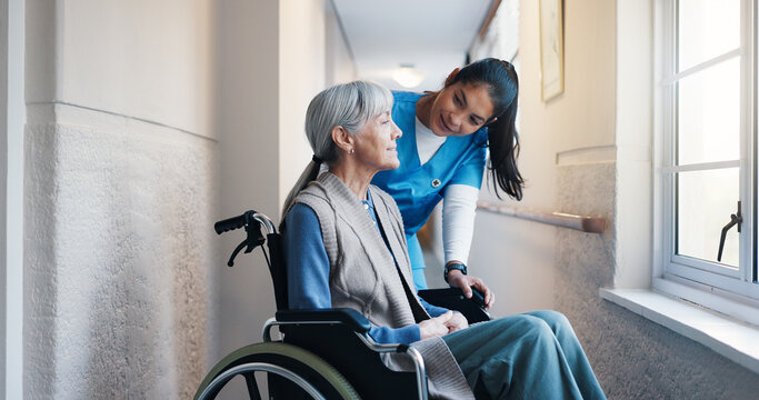Conversation, nurse and old woman in wheelchair for assisted living, elderly care or retirement. Advice, feedback and senior person with disability talking to caregiver for help, support or wellness