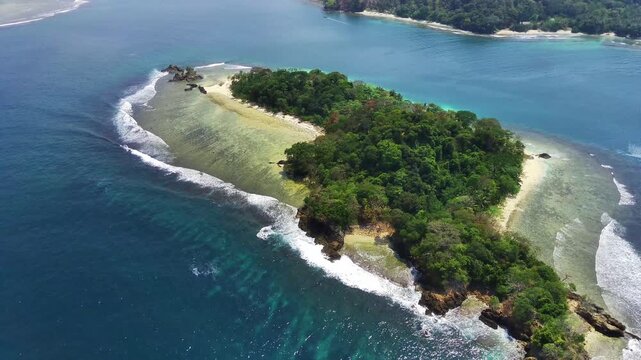 Tropical Island Surrounded by Crystal Clear Blue Waters
