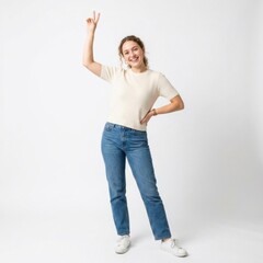 Fototapeta premium Happy young woman standing and pointing up isolated on white background
