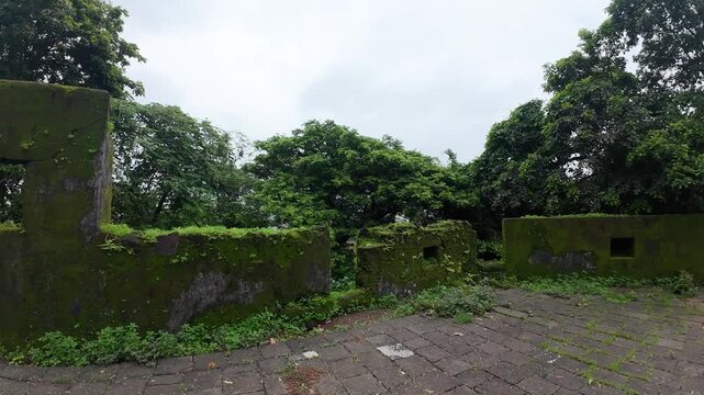 Moss Covered Weathered Stone Walls and Courtyard Ruins of Historic Sion Hillock Fort in Mumbai