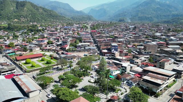Main square (Plaza de Armas) of San Ramon, Chanchamayo. Public town park surrounded by lush green hills in Junin, Peru.
