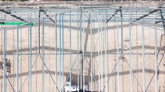 Building progress view from above at construction site showing multiple sections in different stages