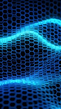 Abstract Wavy Hexagonal Blue Grid Pattern - A close-up view of a blue hexagonal grid forming wavy lines and curves against a dark background.