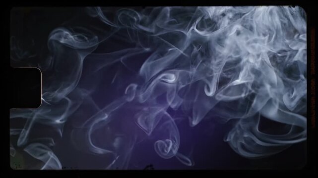 White smoke curling and dissipating on dark background with vintage film frame texture