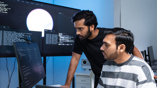 Team engineers software development are brainstorming using computer writing code. Programmer teamwork meetings using technology artificial intelligence work system about cyber security and coding 