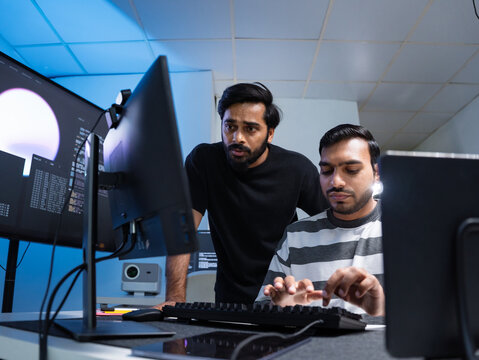 Team engineers software development are brainstorming using computer writing code. Programmer teamwork meetings using technology artificial intelligence work system about cyber security and coding 