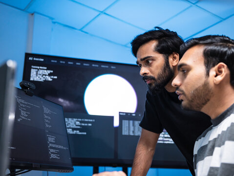 Team engineers software development are brainstorming using computer writing code. Programmer teamwork meetings using technology artificial intelligence work system about cyber security and coding 