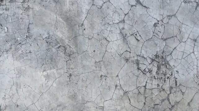 Texture concrete wall of light grey color cement texture background.Grey pastel rough crack cement texture stone concrete,rock plastered stucco wall; painted flat fade background. Side view. close up.