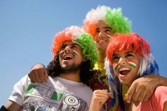 Youngsters with wigs cheering 