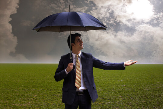 Businessman with an umbrella 