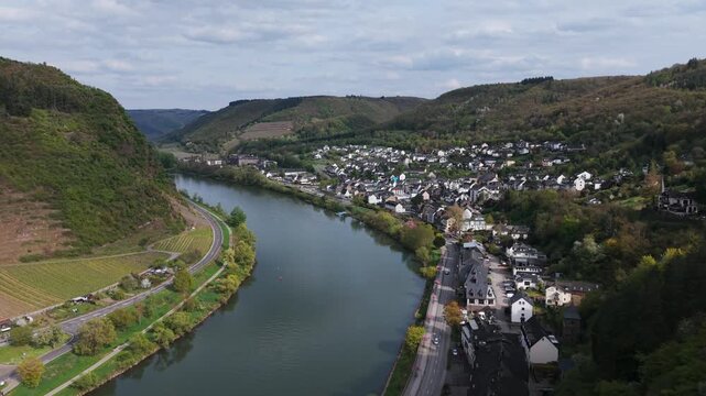 Moselle River curves past the town of Cochem as the drone slowly descends above the valley.