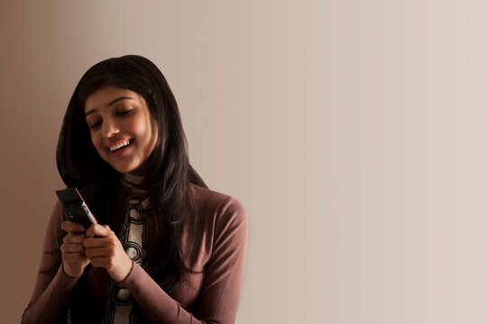 Young girl sending an sms 
