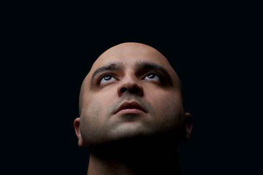 Bald man looking up 
