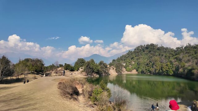 Hiker looking at Deoria Tal lake near Chopta Uttarakhand India