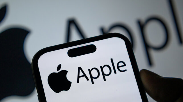 Apple logo and brand name on smartphone screen with grey company icon background for tech news coverage.