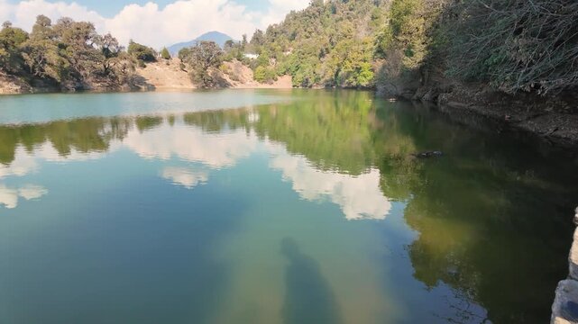 Man sitting by Deoria Tal lake near Tungnath temple in Chopta Uttarakhand India