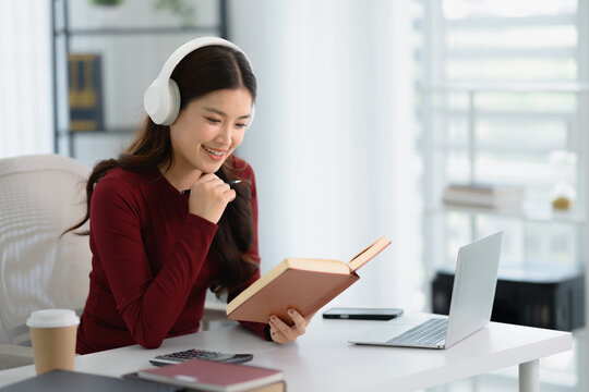 Portrait of confident Asian businesswoman working in office