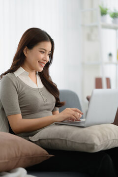 Asian woman use laptop surfing an internet