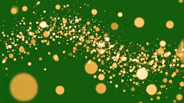 Golden glitter particles form a wavy flowing stream across a solid green background.