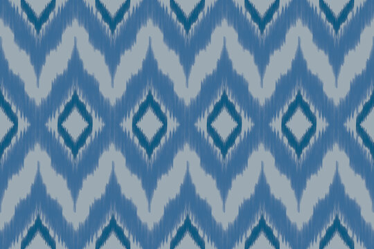 Seamless Ethnic Ikat Geometric Pattern Design with Chevron Zig-Zag and Diamond Motifs in Shades of Blue