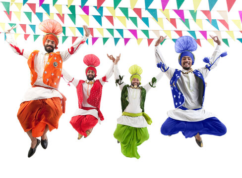 Sikh men jumping in the air 