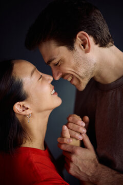 Loving couple looking at each other face to face.