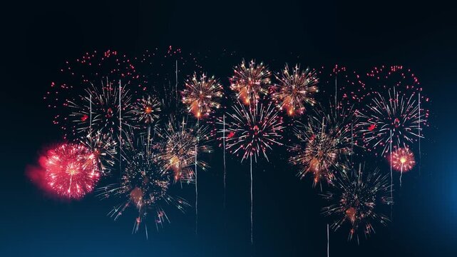 A big festive firework display fills the vast midnight sky with crimson sparks, bright rockets and colorful explosions. Perfect for countdown backgrounds, holiday greetings and celebration promotions.