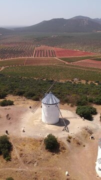 Drone flying over historic Puerto Lapice windmills in Spain's Castilla La Mancha region, an aerial view of Don Quixote's route