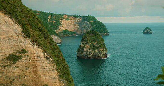 Coastal steep cliffs and blue ocean at Nusa Penida Bali Indonesia