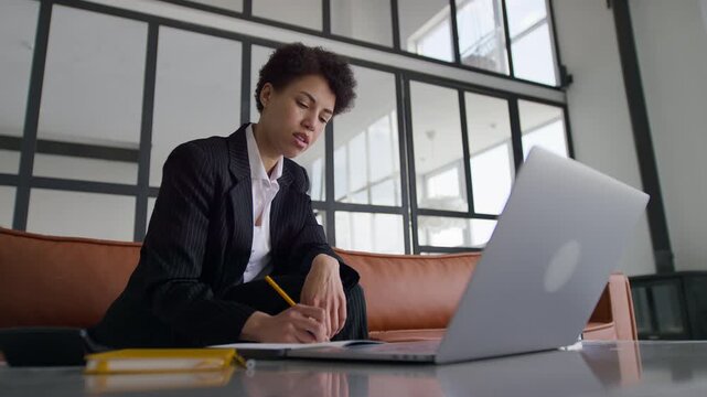 Entrepreneur Taking Notes During Financial Education Course