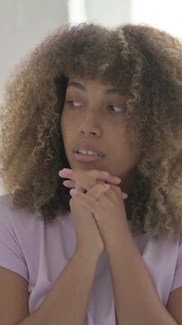 Frightened Young African Woman Looking around in Fear, Vertical Video