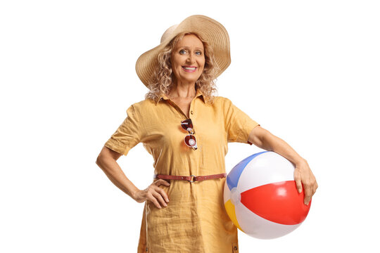 Middle aged woman holding a beach ball