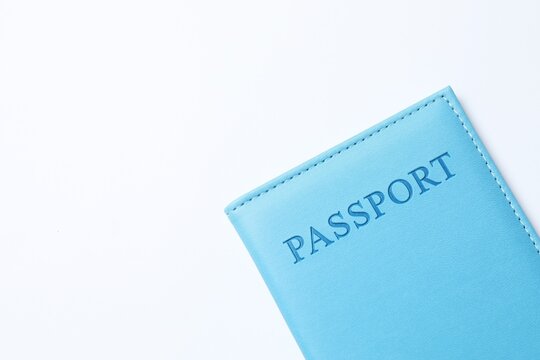 Passport in a blue cover on white background. closeup