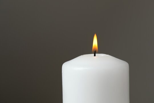 White burning candle, close up
