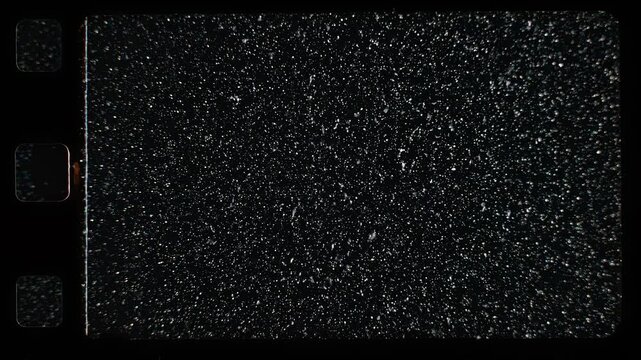 Vintage 8mm film frame with heavy grain and sprocket holes for retro cinema and old movie effects