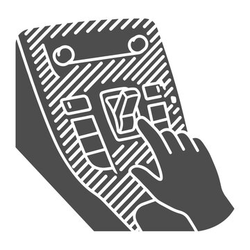 Hand pressing button on electronic control panel.