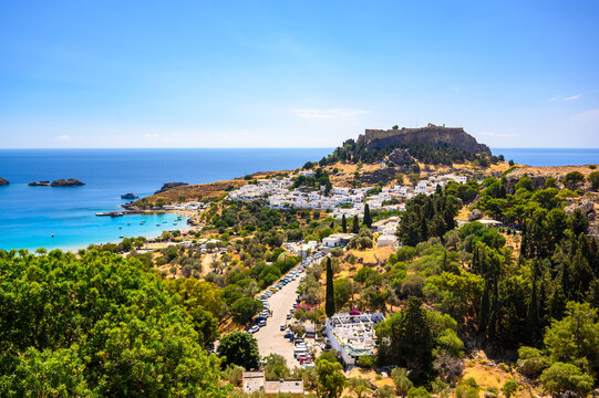 Traditional Lindos Harbor and Whitewashed Village on Rhodes Island, travel destination in Greece;