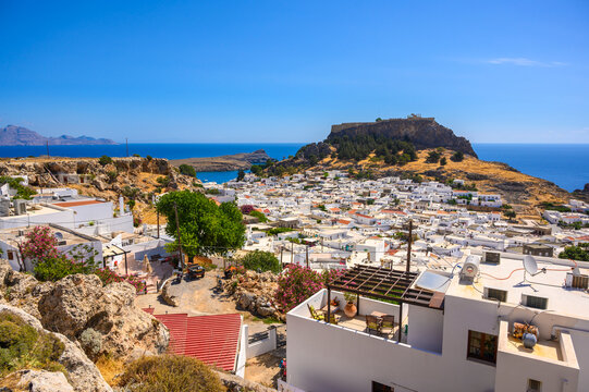 Traditional Lindos Harbor and Whitewashed Village on Rhodes Island, travel destination in Greece;
