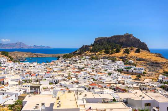 Traditional Lindos Harbor and Whitewashed Village on Rhodes Island, travel destination in Greece;
