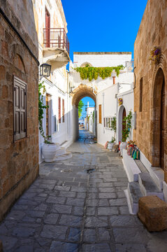 Traditional Lindos Harbor and Whitewashed Village on Rhodes Island, travel destination in Greece;