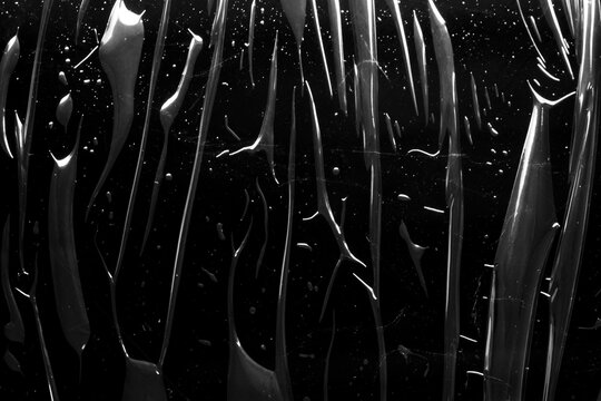 transparent plastic film wrap overlay texture on black background