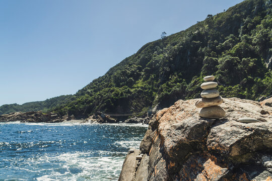 Balanced stones on a rocky beach in Tsitsikamma National Park