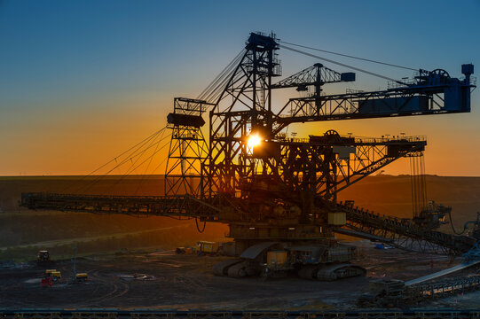 Germany, North Rhine-Westphalia, Juechen, Garzweiler surface mine, Stacker at sunset