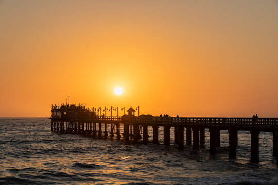 Namibia, Namibia, Swakopmund, View of jetty and atlantic ocean at sunset