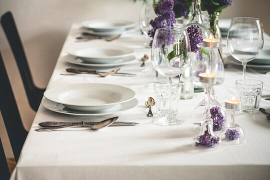 Festive laid table with lilac, Syringa