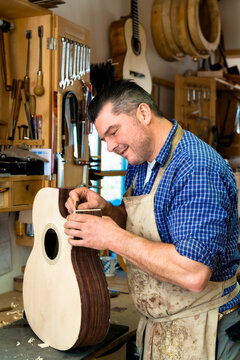 Guitar maker in his workshop