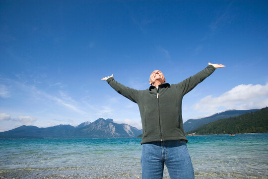 Germany, Bavaria, Walchensee, Senior man cheering