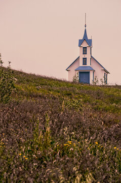 Iceland, Europe: view of the tiny church on a hill in Stodvarfjordur, village located in the East Fjords
