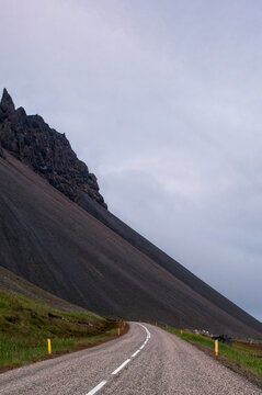 Iceland, Europe: view of the breathtaking Icelandic landscape from the road. Trip on the road, asphalt, book cover, symbolic, freedom, travel 